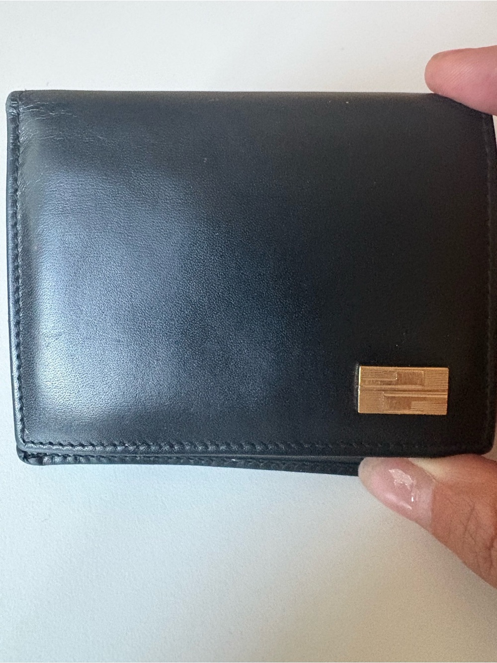 Gucci Black Leather men’s Wallet with Gold-Tone Accent